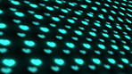 Blue CGI hearts spinning against a dark background. Heart shape special effects turning and rotating in studio against a black background. Rows and columns of bright heart shaped lights on a screen