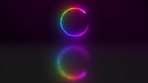 Illuminated rainbow neon lights in a circle shape or pattern against a dark background in studio. CGI circular art isolated on a black background. Special effects reflected in a mirror image