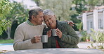 Relax, comfort of loving senior couple drinking coffee in nature, affectionate romance laughing in a garden. Relaxed, caring and mature relationship in love enjoying a day outside together in summer.