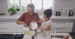 Grandmother and child baking, cooking and making a cake, dessert and homemade cookies or biscuits in a home kitchen. Cute, fun and little girl helping senior with mixing pouring flour while bonding