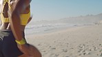 Active, fit and sporty athlete running, jogging and sprinting on a sunny beach shore. Motivated, dedicated and fast woman with stamina doing workout, exercise and training by the ocean from the back