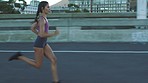 Running, exercise and fitness cardio girl working on extreme marathon training in city, asphalt road or street. Energy, sport woman or runner sprinting doing a workout for health and goal motivation