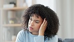 Depressed woman with stress, anxiety and frustration at home with a headache or migraine. Pain and discomfort from problems, worry and issues. Mental health and frustration are giving her problems