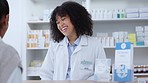 Friendly pharmacist assisting patient with prescription medication, pills or medicine at a pharmacy, clinic or drug store. Female pharmaceutical with customer service, giving medical advice