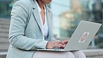 Remote business woman writing and typing an email message on her laptop outside anywhere with wireless technology. Entrepreneur or freelance worker working on a digital project while sitting outdoors