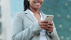 Phone message, texting and typing with a business woman standing outside in the city. Closeup of a female browsing social media scheduling appointments and updating her calendar online from below