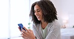 Relax, social media and woman on smartphone in bedroom looking at funny message communication. Black girl smiling while laughing at silly text on cellphone internet app for entertainment.