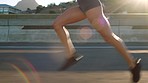 Runner, fitness and woman road running in urban city for training, workout and exercise in a summer sport alone. Speed, healthy and young girl is a fast sprinter with endurance, cardio and body goals