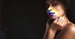 Rainbow skin, LGBTQ and black woman portrait in studio dark background and mockup. Prism light, creativity and cosmetics skincare beauty or queer model face for body health glow or shine and wellness