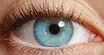 Vision, blue eye and macro of awake person looking with beautiful and natural beauty iris color. Closeup of healthy, isolated and stunning eyes of a person with moving pupil at optometry test.