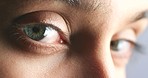 Eyes, secret and vision of a woman portrait looking at camera or staring for crime investigation, human rights or serious lawyer. Young person face macro or zoom detail with movement for awareness