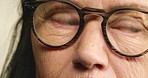 Red eyes, senior woman and glasses for bad vision and eyesight problems with glaucoma, inflammation or myopia. Old age and deteriorating health of elderly female looking away and feeling sad