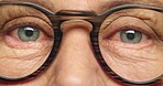 Vision, zoom and epilepsy eyes of senior man with glasses for stress, anxiety or depression with blink motion. Skin, face and eye test in optometrist exam for healthcare, insurance or wellness