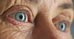 Senior woman, blue eyes and vision in thinking, planning and looking sad in nursing home or house interior. Zoom, texture or face skin of stress, anxiety or mental health burnout in lonely retirement