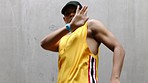 Dance, hip hop and artistic man dancing to music while practicing for performance in an outdoor studio. Freedom, art and young guy dancer moving to the rhythm or beat of a song with a gray background