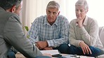 Senior couple, financial advisor and clients talking insurance, savings and investment contract with lawyer. Man and woman sitting together and consulting with a banker or realtor for advice and help