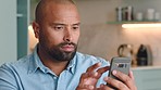 Unhappy, phone and man texting on a sofa, angry and annoyed with online pop up ads. Glitch, complain and frustrated black guy writing email or message to internet provider to cancel subscription