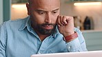 Idea, laptop and remote with a business man working from home and thinking in his office or study. Freelance, trading and reading an email with a male entrepreneur at work from inside of his house