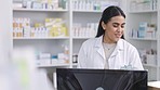 Pharmacist, indian woman and phone call for medicine help, medical insurance and pills support. Portrait of smile, happy or trust healthcare pharmacy worker in retail product store with computer tech