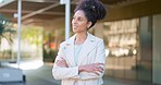 Happy, confident and smiling business woman thinking of work success with arms crossed outside the city. Satisfied face of a cheerful, joyful and proud female corporate professional feeling empowered