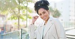 Urban, girl portrait and playing with hair to flirt with a cute and attractive pose in cityscape. Romantic, beautiful and young african woman with optimistic and happy smile in the city.