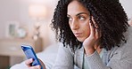 Lonely, bored and young woman on mobile phone, social media and texting web apps in home bedroom. Sad, alone and unhappy female in isolation waiting online connection, mobile and internet technology 