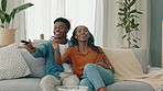 Black couple, laughing, and tv play fight over television control or remote on house living room sofa and home interior. Smile, happy and fun man and woman bonding for movie on media channel network