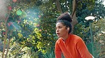 Exercise, fitness and breathe with athletic woman tracking her progress on a smartwatch while running in a park. Young female taking a break from morning cardio workout, listening to music or radio