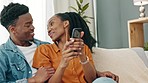 Home, smartphone and couple reading notification confirmation message, text or email and relax on a sofa. Black woman, man or people looking at social media content or an online digital ecommerce app