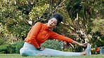 Fitness, health and wellness sport woman stretching on grass, garden or nature environment in park. Relax, meditation and yoga girl with exercise, training and workout outdoor
