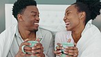 Coffee, smile and a couple drinking in bed together on a lazy day at home. Love, a winter warm up and a hot beverage on a cold morning, black woman and happy man with duvet and a fresh cup in bedroom
