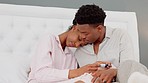 Home pregnancy test, couple support and pregnant sad woman in bedroom. Sexual healthcare anxiety, infertility crisis and miscarriage problem. Results upset girlfriend and boyfriend comforting girl
