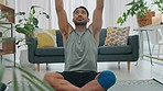 Meditation, yoga or zen asian man in relax, peace and mental health training, workout or exercise in house living room. Prayer hands, worship or reiki mind energy support in wellness lockdown fitness