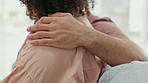 Support, care and hug of a man with a sad and depressed woman depressed on a house sofa. Depression, mental health problem and bad news anxiety of a female in a home living room with a male embrace