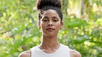 Natural beauty, face and environment with a beautiful woman with confidence and a smile outside in calm nature with green trees and peace. Portrait of a Brazilian female outside for mental wellness