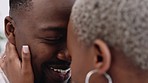 Love, commitment and happy black couple touching heads while standing together and sharing a romantic moment. Closeup of African man and woman in a healthy and happy marriage and relationship