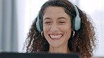 Happy senior woman streaming a comedy movie or stand up comic online via an internet connection on laptop. Laughing, smiling and excited person with headphones at home watching a funny film on tablet