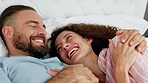 Funny couple talking, communication in bed and comic conversation in bedroom together in morning, hug during discussion and happy with love in house. Man and woman laughing at comedy joke in home