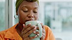 Black woman drinking coffee, tea and happy smell for home comfort, relax and carefree rest. Living room, smile and satisfaction young african person sipping on warm cup, fresh mug and hot beverage
