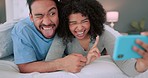 Comic, couple and phone selfie in bed with crazy face poses in a home bedroom having a fun time. Comedy, funny and joke faces of happy people on a morning using mobile technology together as a house