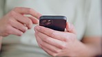 Man hand with phone on social media app reading internet news or texting message to a contact. Zoom in of male with mobile smartphone technology while sending message and communication online the web