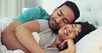 Happy couple, sleep and a hug in bed in the bedroom, house or home. Love, romantic man and woman hugging, cuddle or embrace in the morning in their room with a smile together while being intimate.
