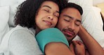 Love, hug and relax couple sleep in bed together cuddle, happy and smile while at peace dreaming in home bedroom. Romantic young man and woman bond while sleeping, rest and taking cozy comfort break