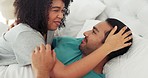 Interracial couple, laughing or love bond in bedroom, house interior, home or hotel on honeymoon morning. Smile, happy or comic black woman with asian man or people in relax, trust or safety security