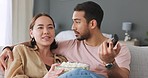Couple watching tv, eating popcorn and choice of movie on sofa, love of comedy show and happy with film on television on sofa in house. Asian man and woman on couch for news on subscription service
