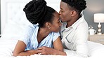 Love, support and trust between black couple sharing a special bond and communication while spending time in the bedroom. Commitment, marriage and understanding with man kissing head of woman 