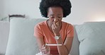 Stress, scared woman with home pregnancy test looking sad for unplanned baby, health risk or infertility. Anxiety, fear or worried black woman waiting for results from pregnant testing kit on a sofa