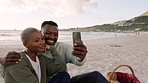 Selfie, black couple and love during a beach picnic on the sand in summer. Happy man and woman taking a picture with a phone for social media together while on a romantic leisure date by the sea