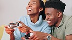 Excited gamer couple with an action video game and console on TV in their living room. Happy, excited black people, woman and man or friends enjoy fun online streaming activity with funny smile