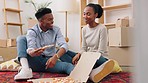 Happy couple with pizza moving into new house together and eating on living room floor with happiness in real estate. Black people and hungry woman with fast food in apartment property and boxes